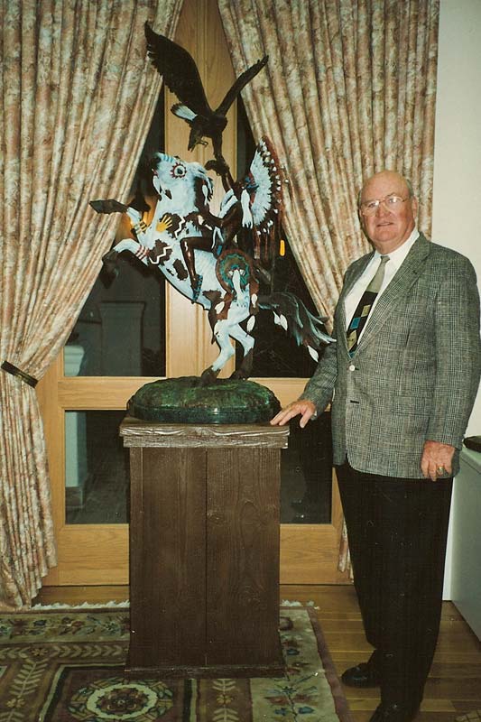 Bob Pond with the Native American themed Spirit Brothers sculpture